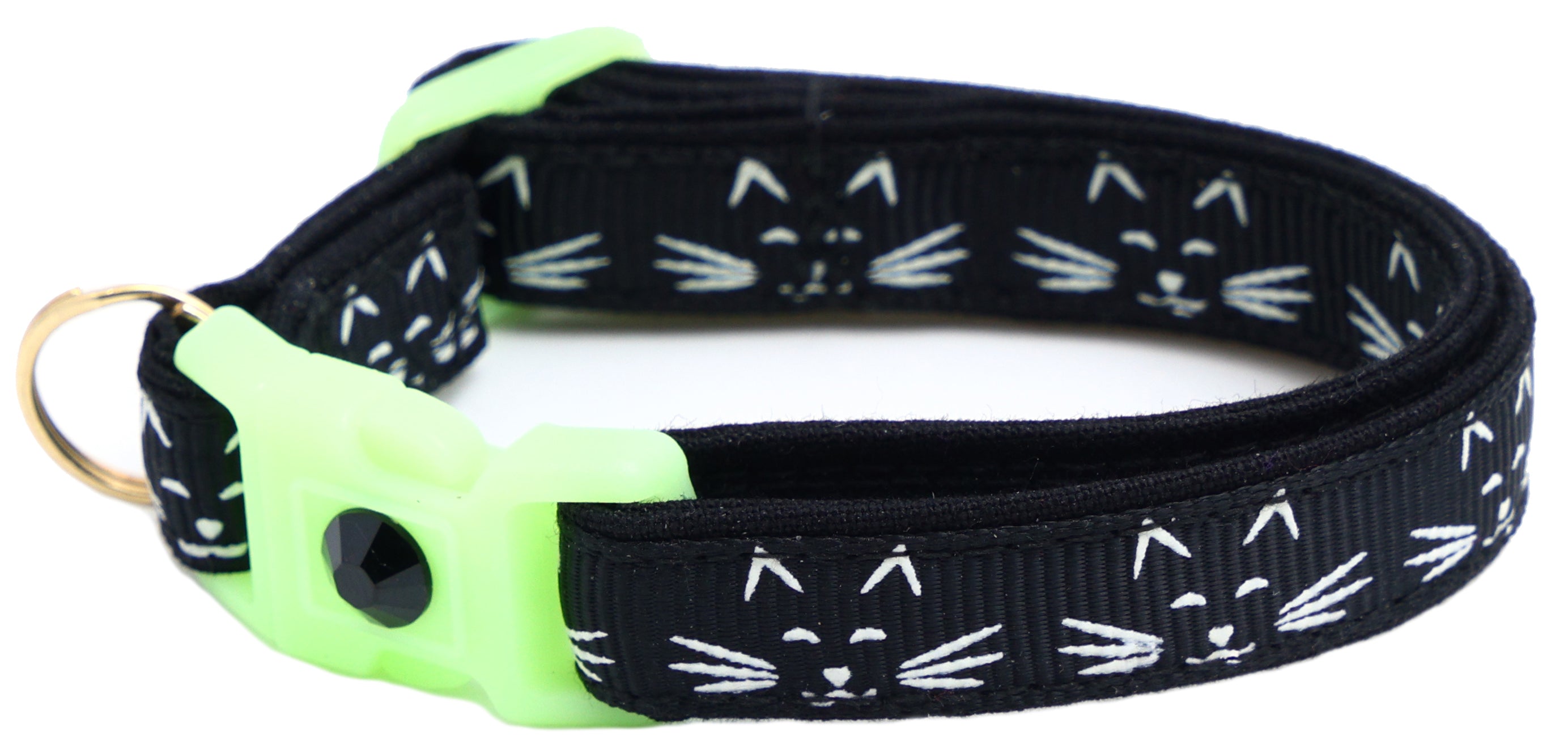 A glowing cat faces breakaway collar made of reinforced cotton, featuring a bell and charm, perfect for nighttime visibility.